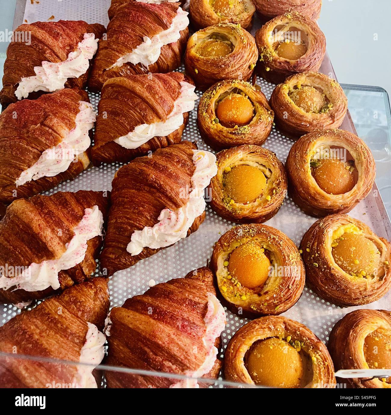 Apricot pastries and cream filled Croissants at the Buka bakery in Copenhagen, Denmark. - Smartphone Captured Stock Image