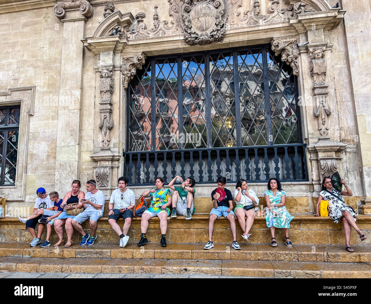 Tourists and locals trying to cool down during European heatwave in Palma Mallorca in the Balearic Islands Stock Photo