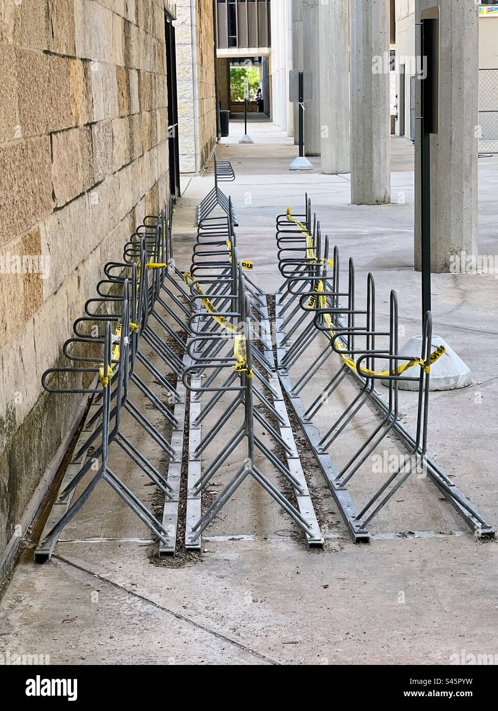 Bike racks stacked against wall for construction work. Humanities