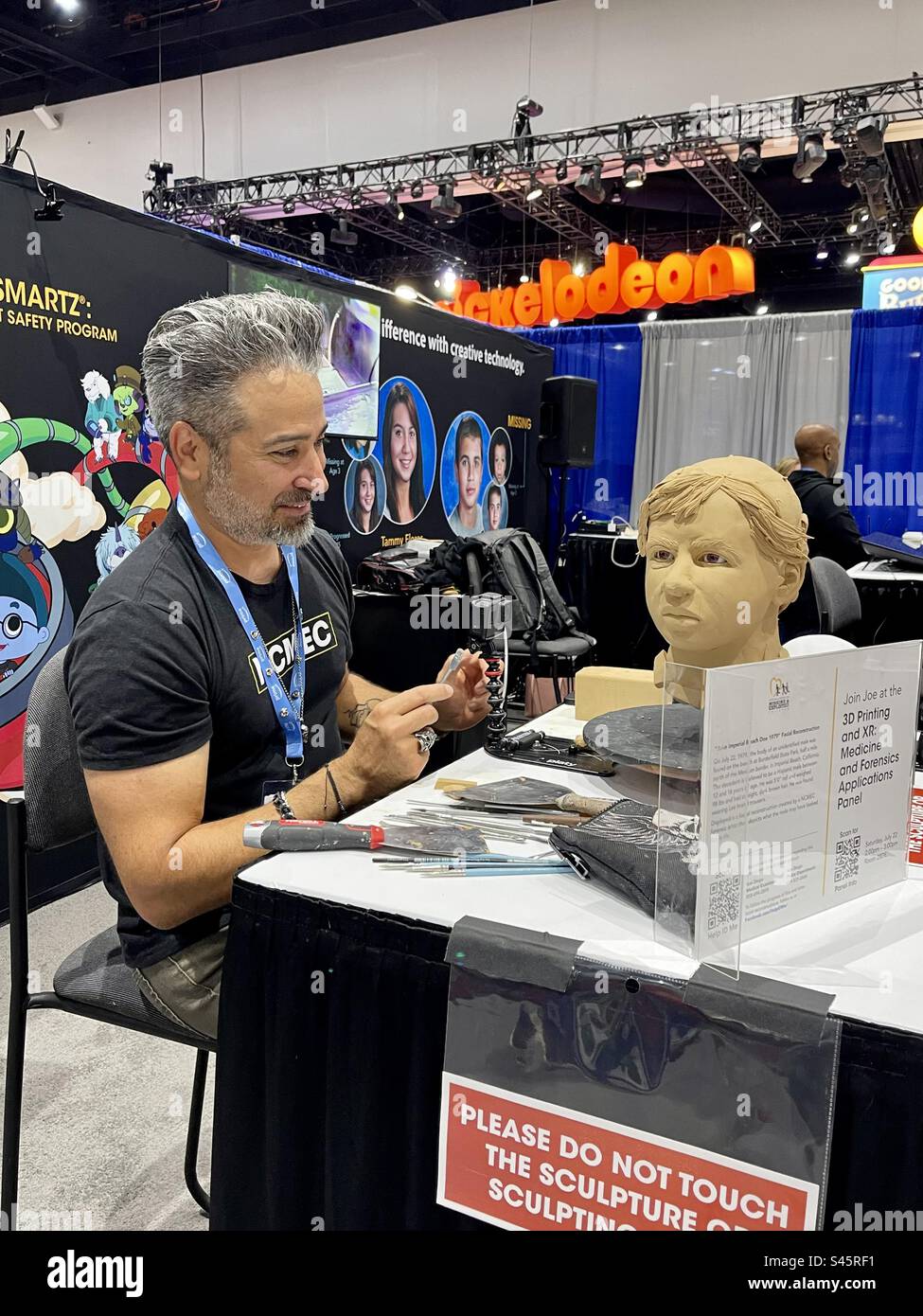 Artist sculpts face at Comic Con International day two held on July 21, 2023 in San Diego, California. - Smartphone Captured Stock Image
