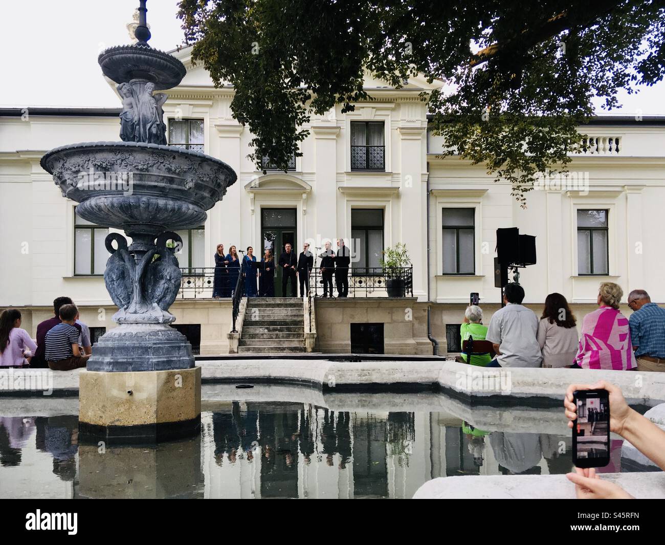 Octovoice chamber choir concert in park of Lenck villa, Sopron, Hungary - Smartphone Captured Stock Image