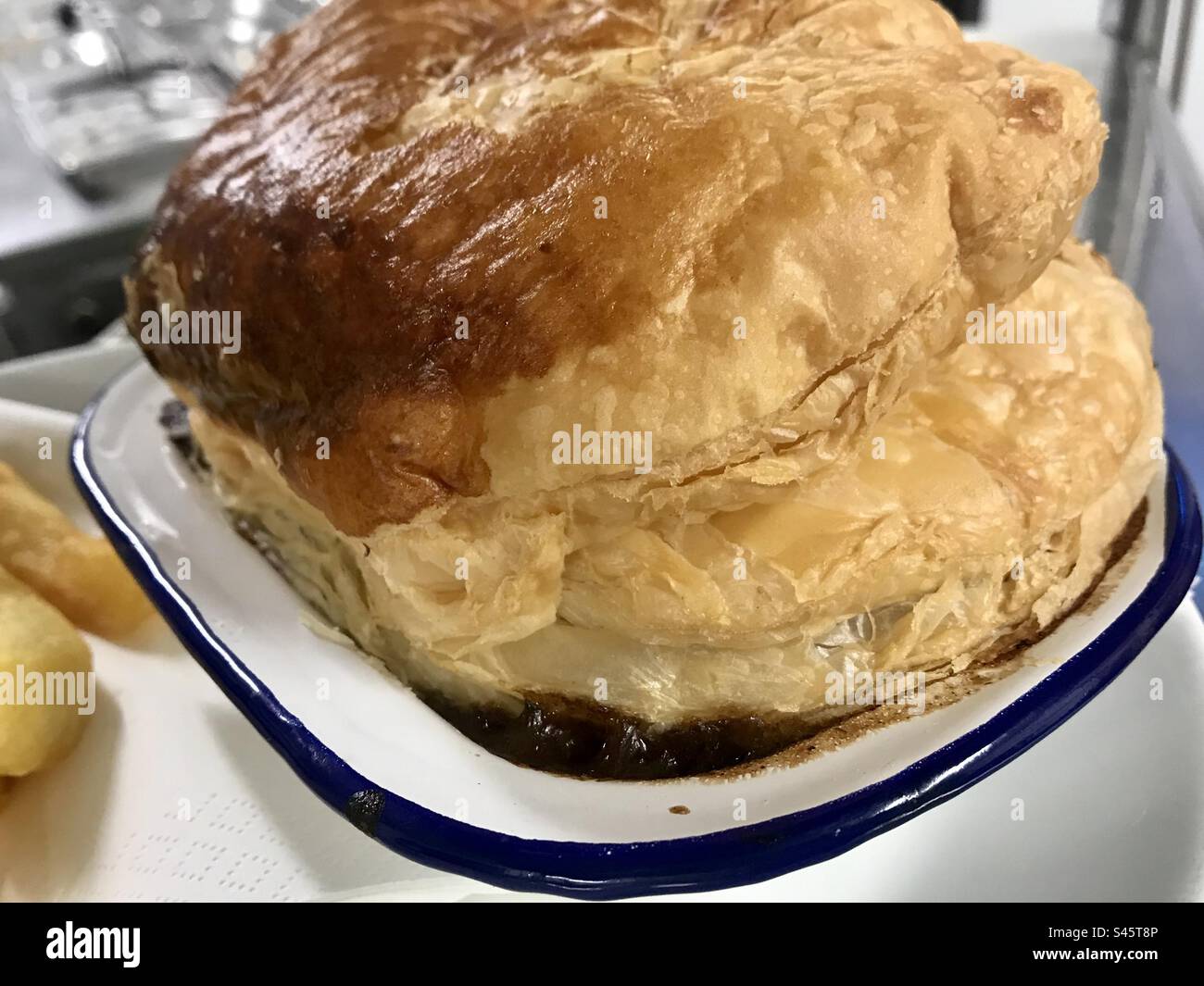 Steak pie in enamel pie dish with puff pastry top Stock Photo Alamy