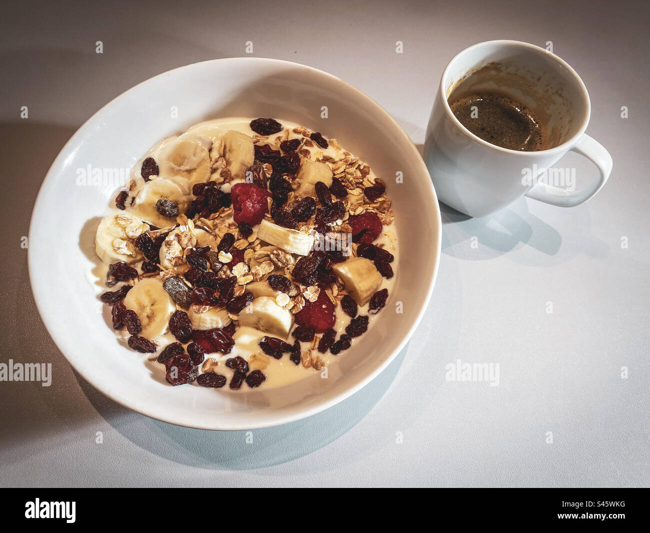 Healthy breakfast of muesli and black coffee - Smartphone Captured Stock Image