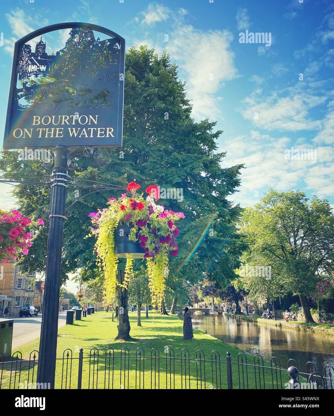 A photograph of a scenic landscape view in Bourton on the Water. Beautiful English Cotswolds village on a sunny day. - Smartphone Captured Stock Image