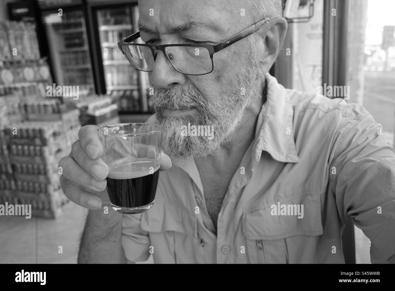 Senior man drinking coffee Stock Photo