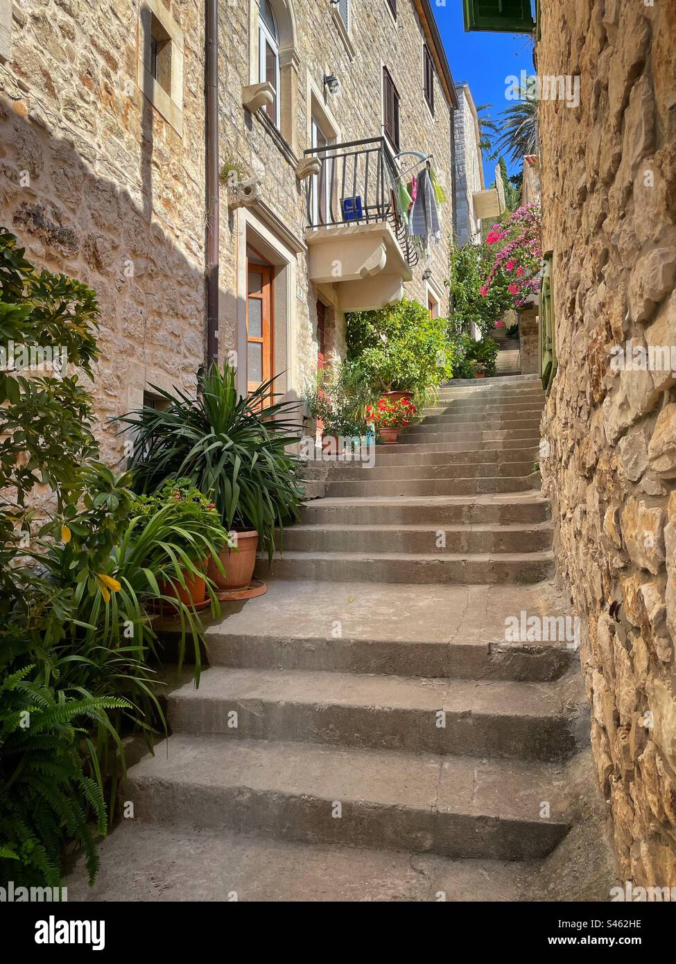 Steps leading upwards in a side street of Hvar, Croatia. - Smartphone Captured Stock Image Steps leading upwards in a side street of Hvar, Croatia. - Smartphone Captured Stock Image