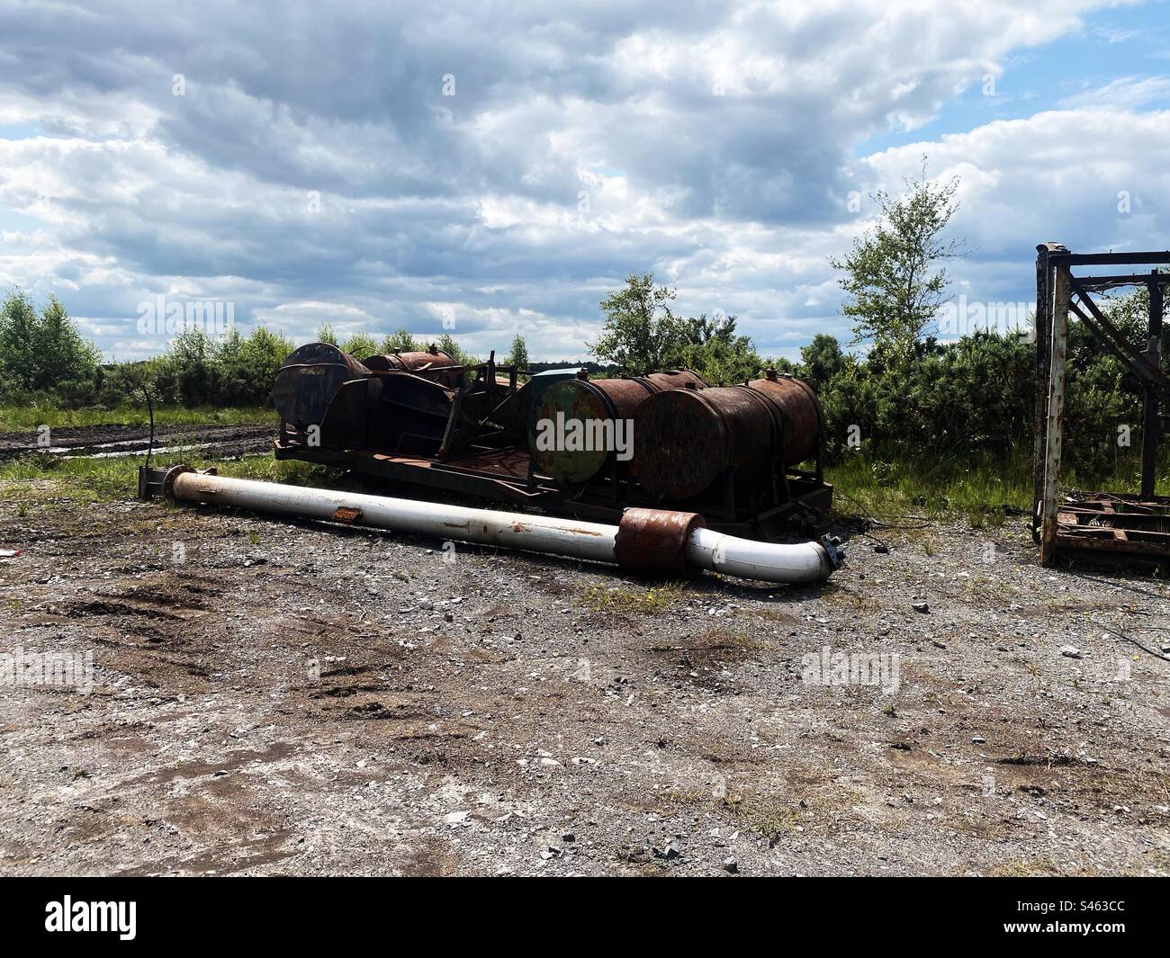 Old rusty abandoned machinery once used on a nearby bog near Cloondara, County Longford, Ireland. - Smartphone Captured Stock Image