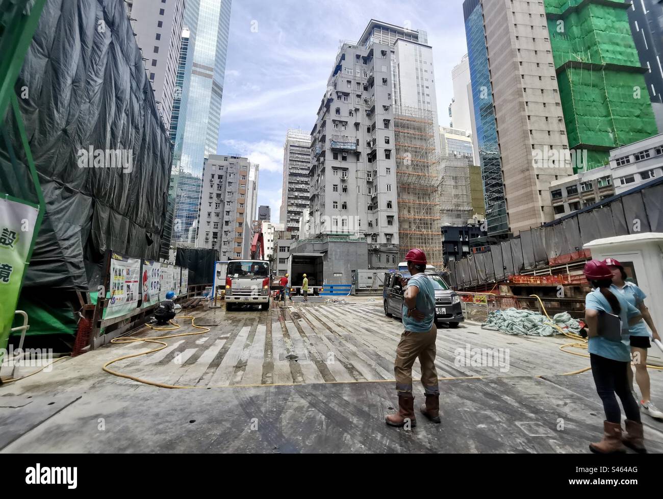 New construction site of a modern building replacing an old building in Central districting Hong Kong. - Smartphone Captured Stock Image