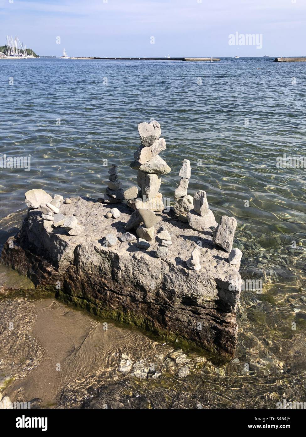Balancing stones on a rock. - Smartphone Captured Stock Image