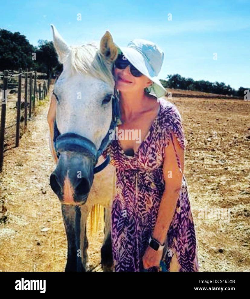 Women and horse in Spain. Horse field. Visiting my horse. Spending time