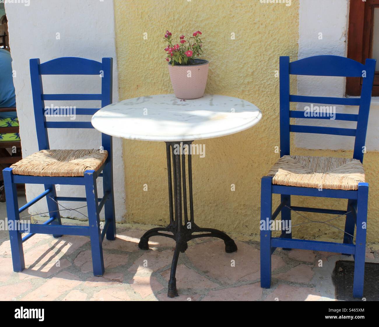Blue chairs and white table, Kefalonia, Greece - Smartphone Captured Stock Image