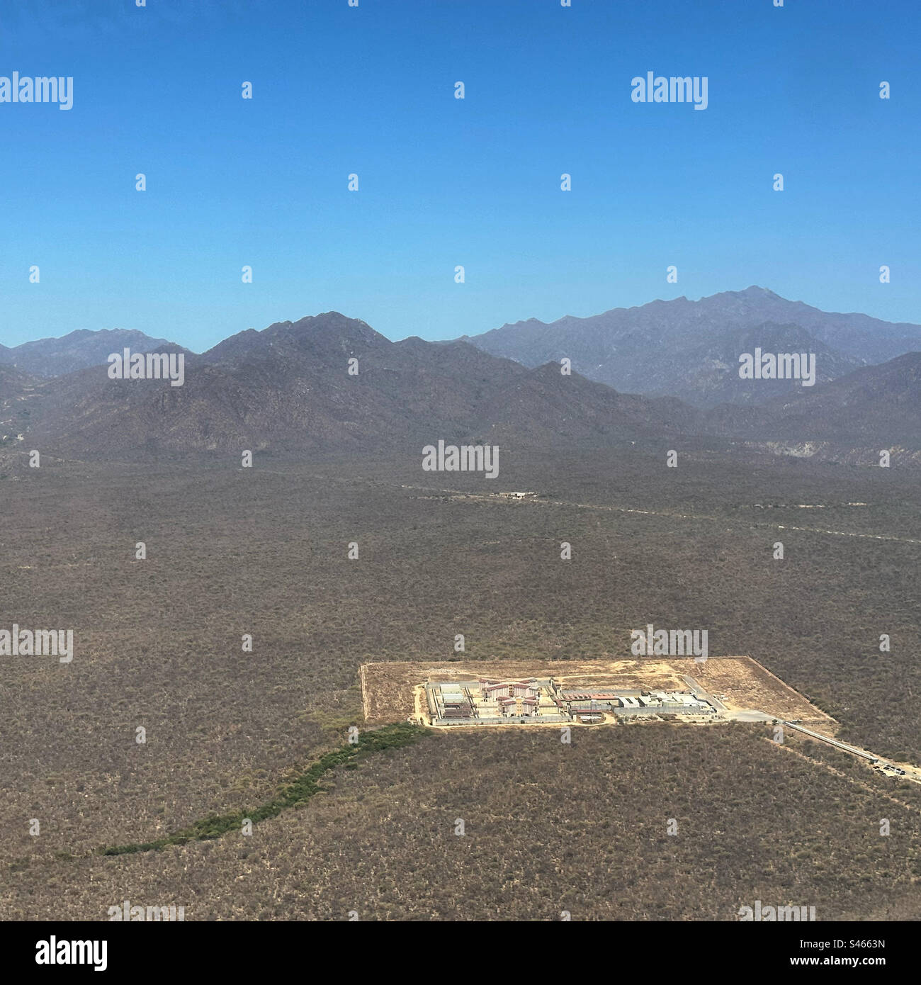 June, 2023, aerial view of a prison and surrounding landscape, Baja California Sur, Mexico - Smartphone Captured Stock Image
