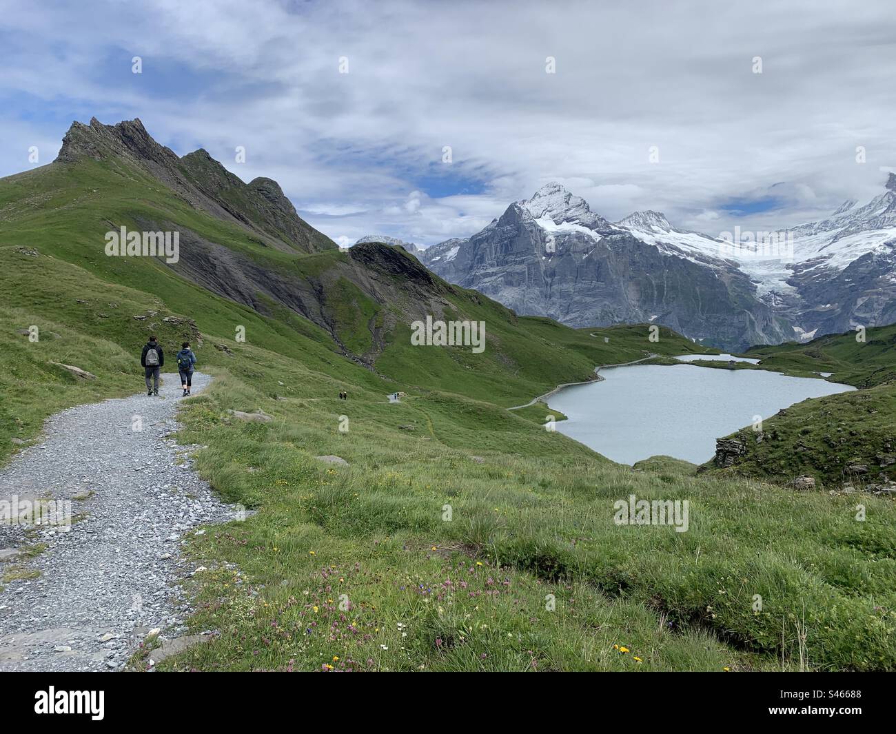 Hiking in Swiss alps lake bachsee Stock Photo