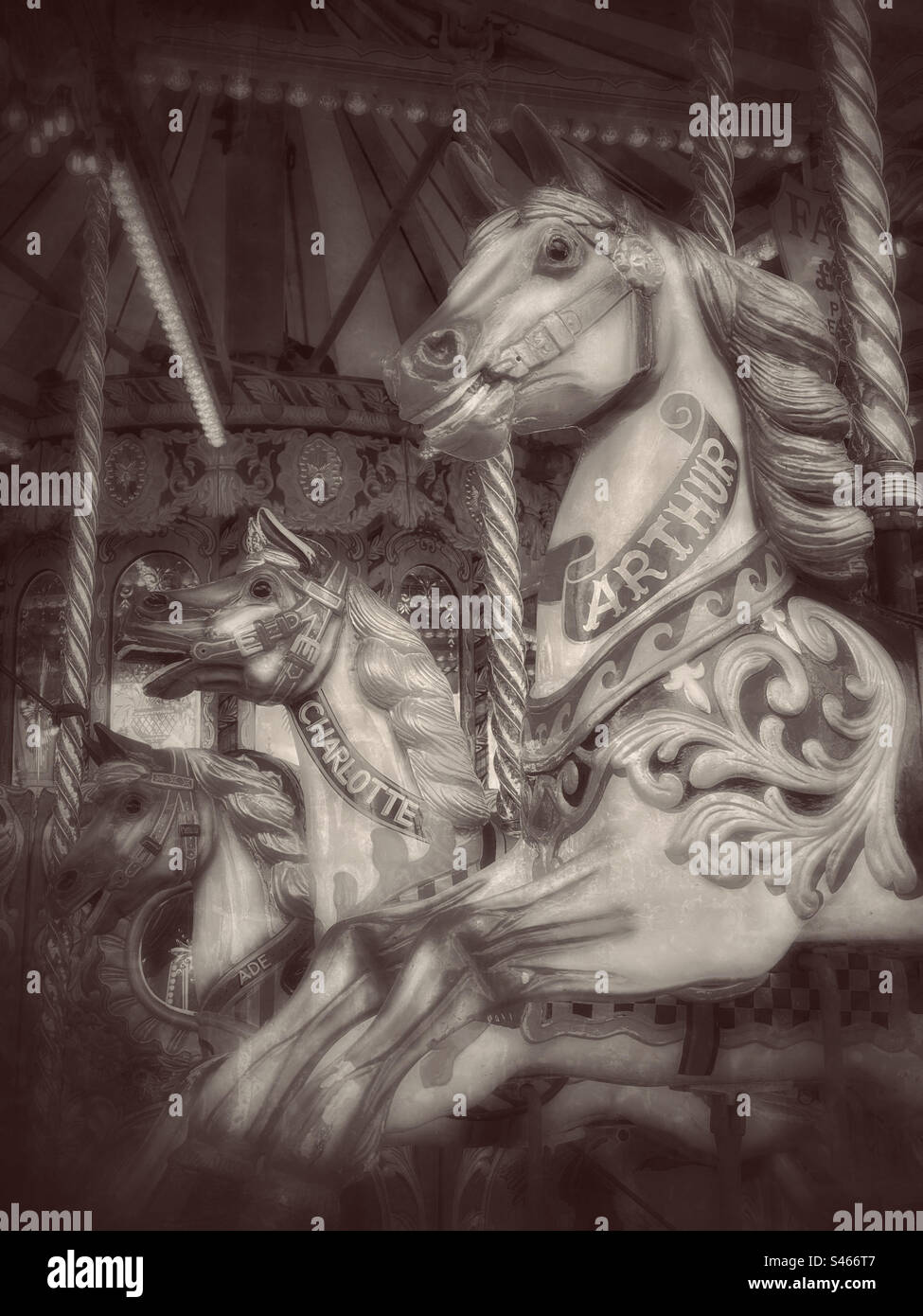 Three Horses on a Fairground Carousel Ride. No people, atmospheric effect. Photo ©️. COLIN HOSKINS. - Smartphone Captured Stock Image