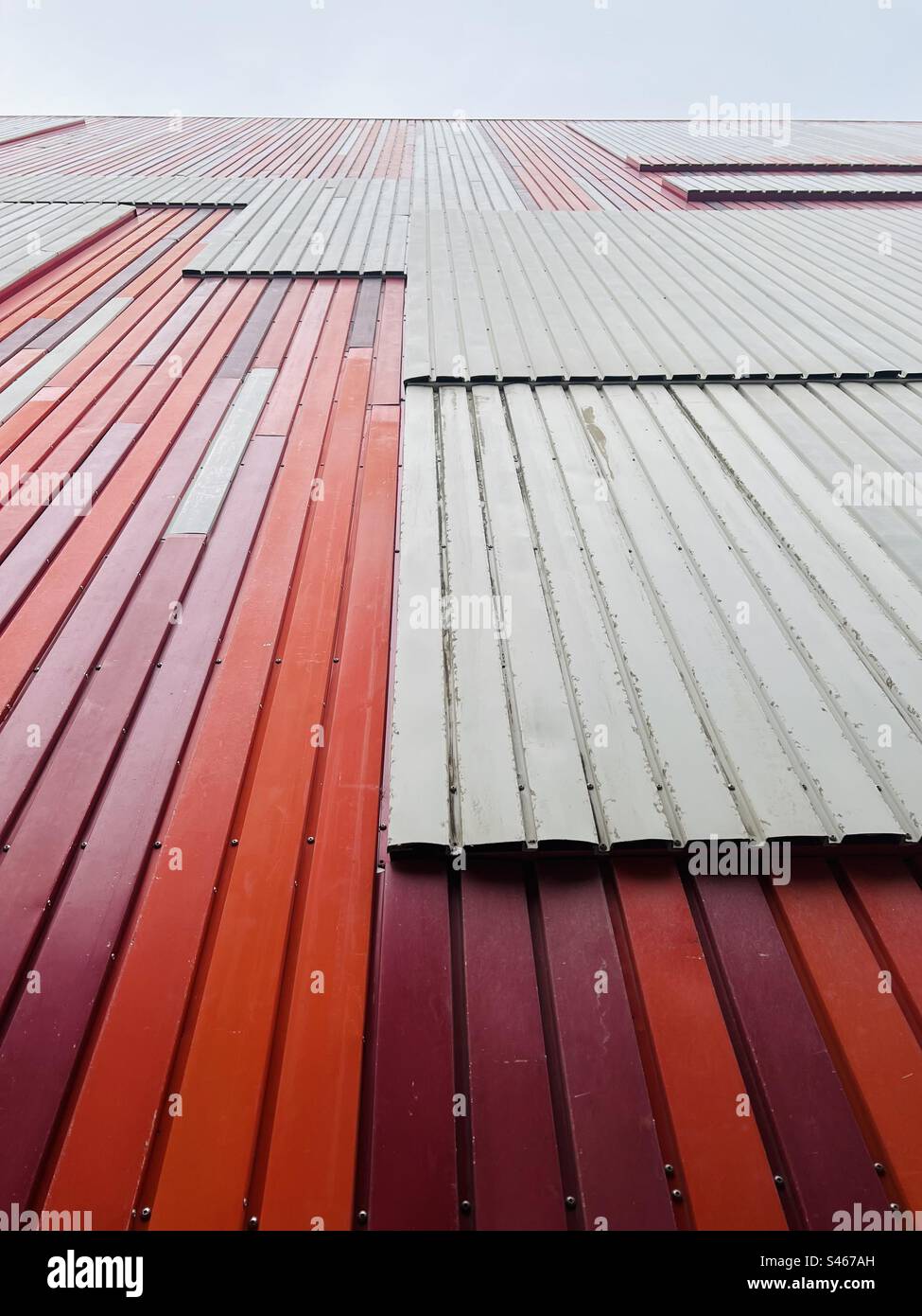 Detailed shot of Reused red and white facade cladding on the National Slovak Gallery in Bratislava, Slovakia - Smartphone Captured Stock Image