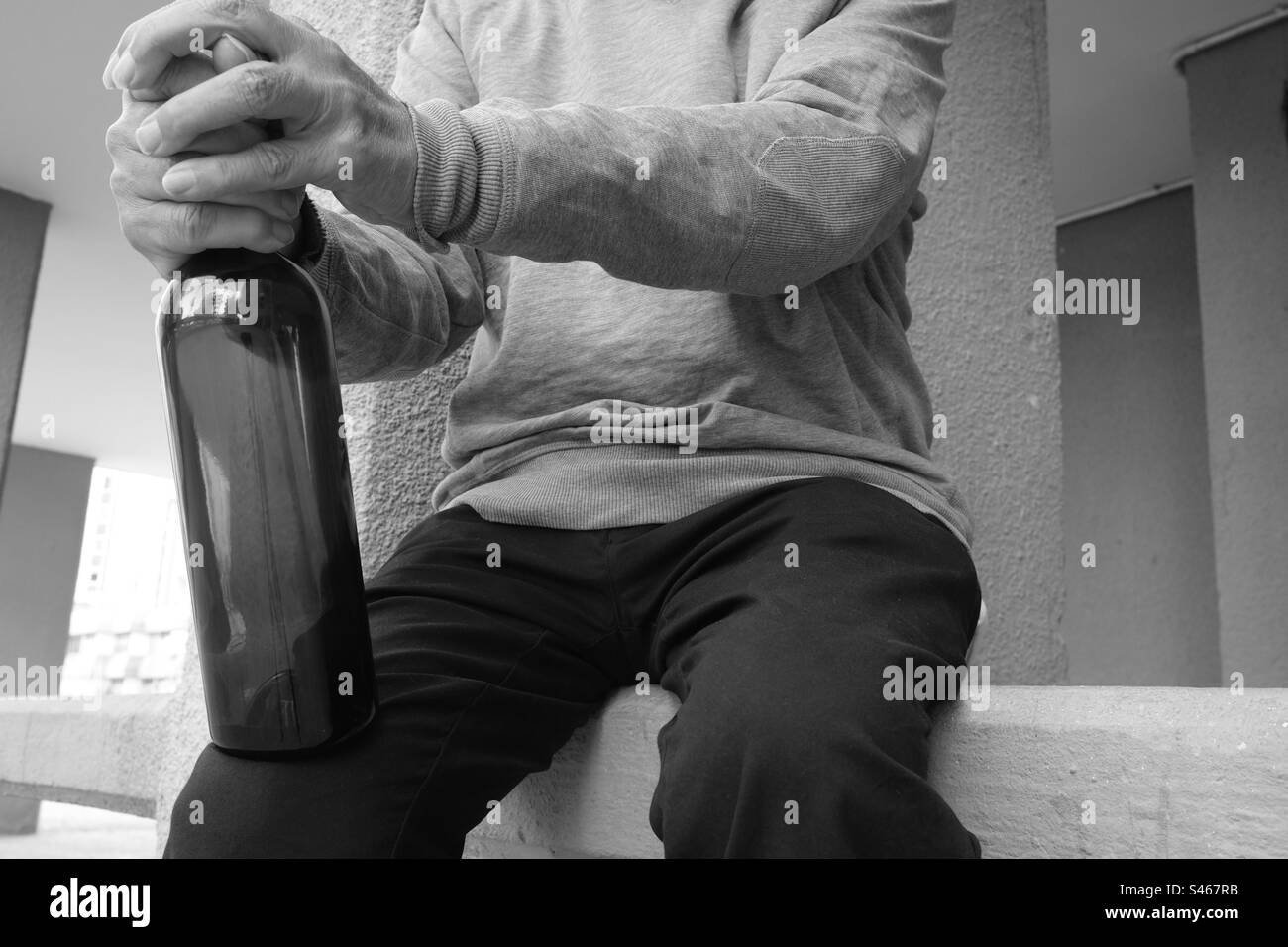 Old man victim of alcohol addiction Stock Photo
