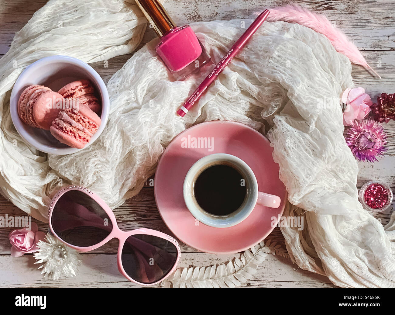 Pink & white flat lay with coffee, macaroons, cosmetics & shades - Smartphone Captured Stock Image