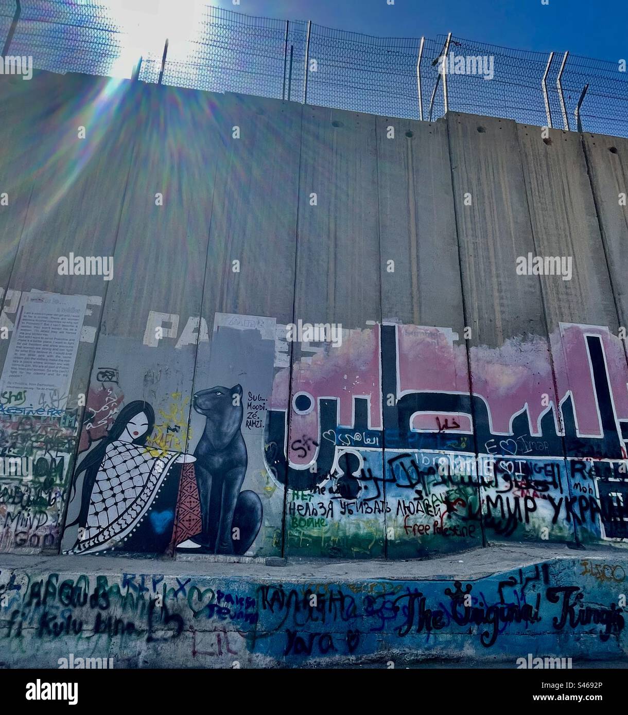 Murals decorating the Israeli security barrier in Bethlehem, Palestine. Stock Photo