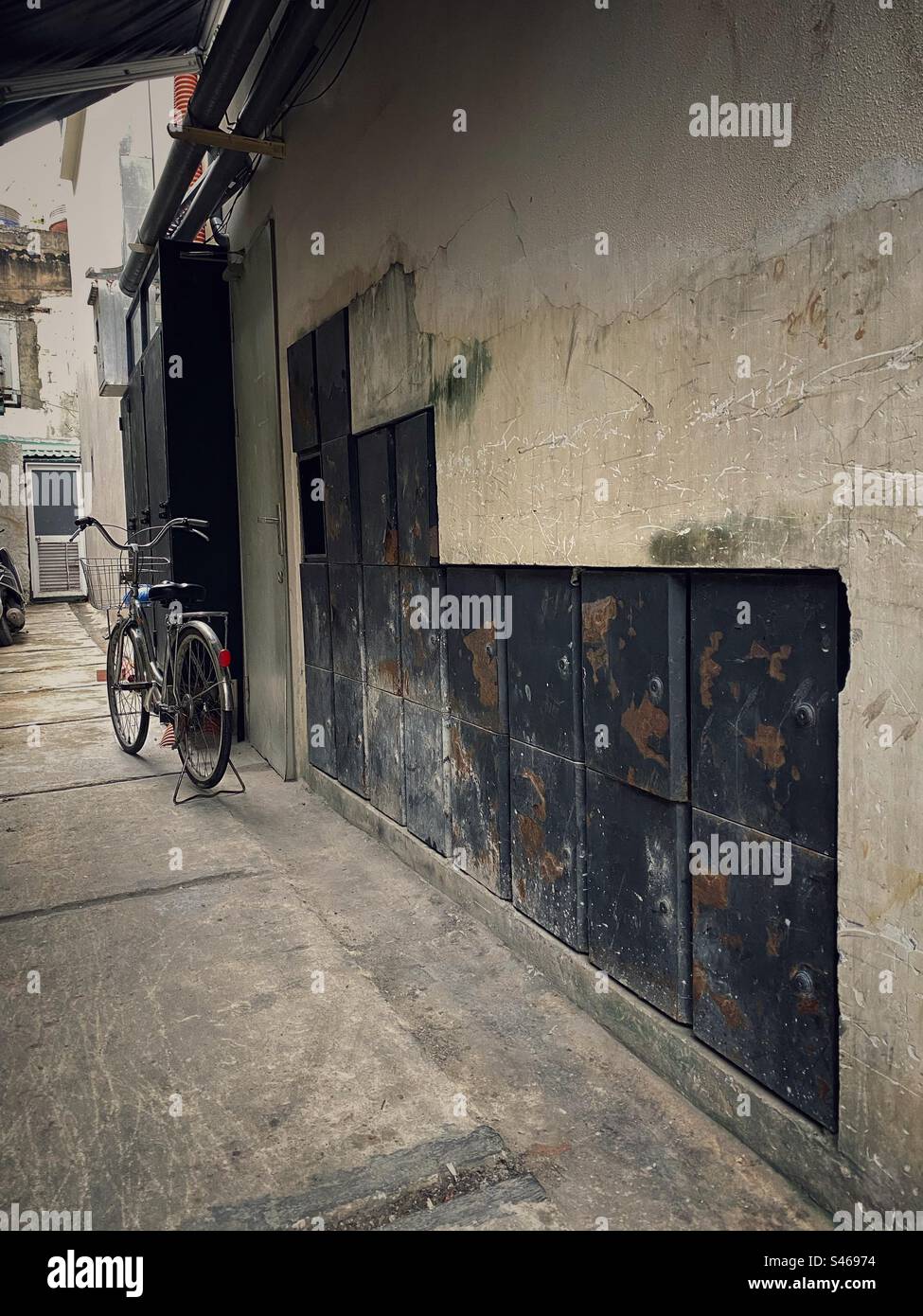 Old courtyard with metal lockers in the wall. - Smartphone Captured Stock Image