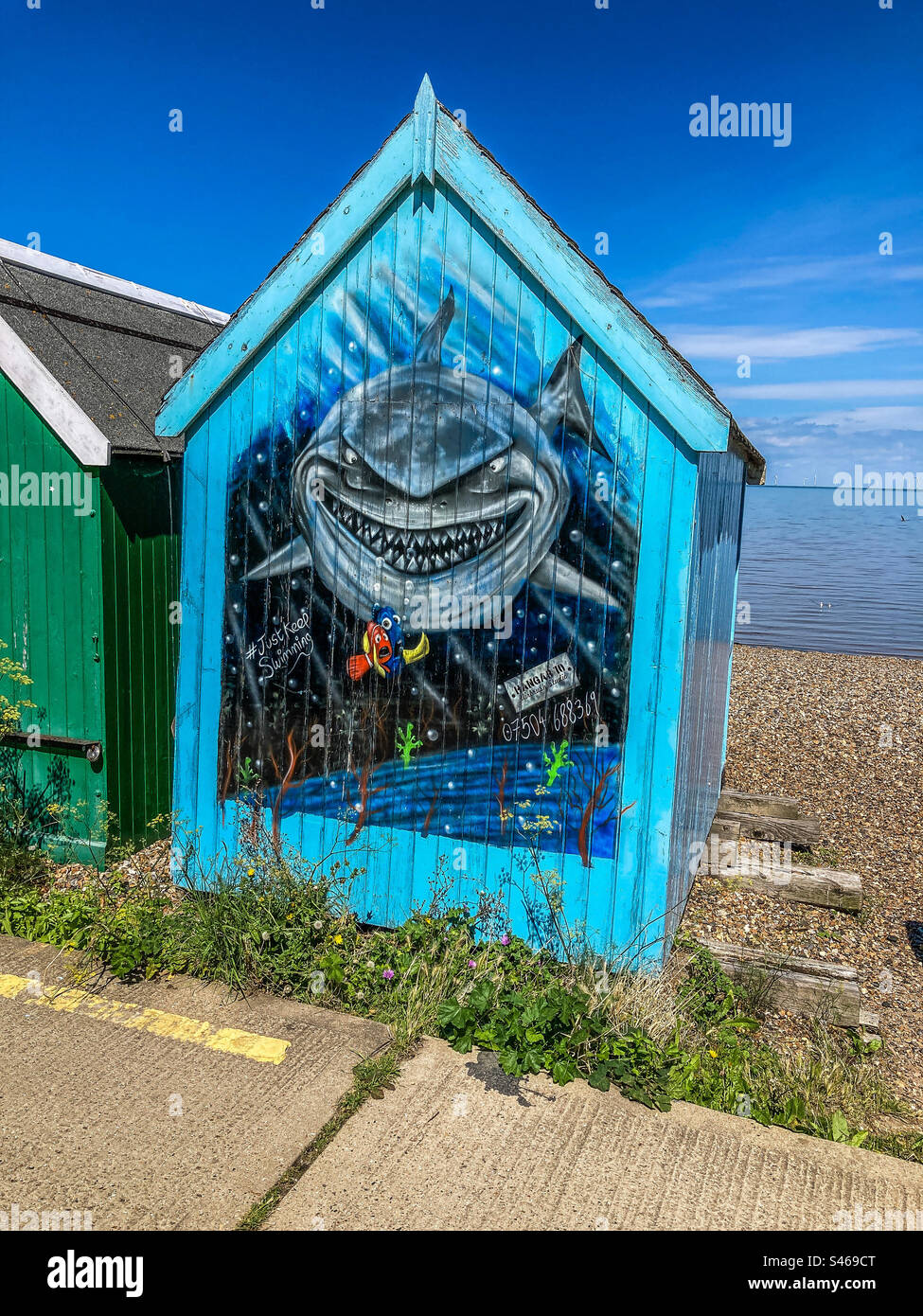 Grinning Shark painted onto a beach hut, at Herne Bay, Kent Stock Photo