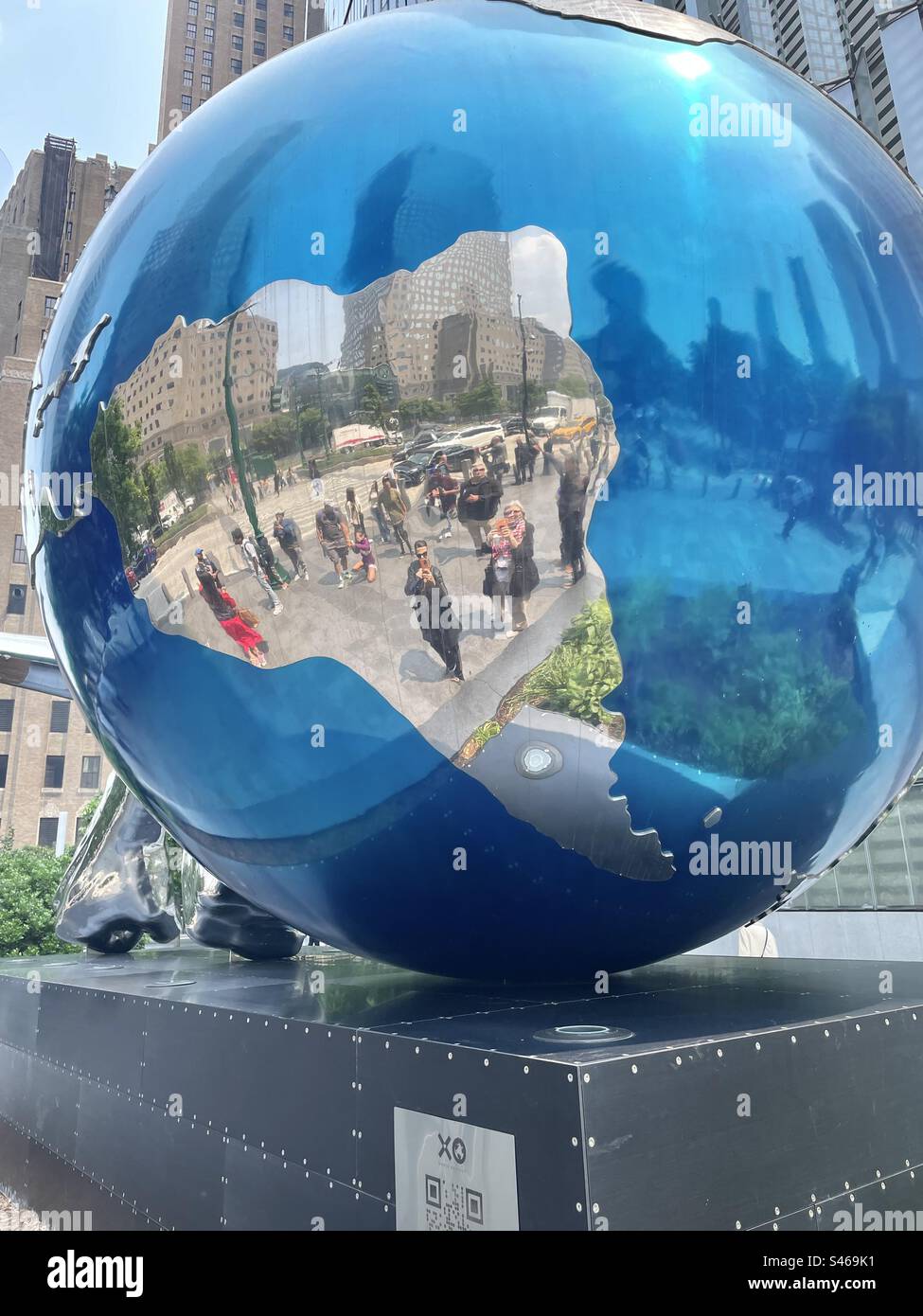 Giant reflective blue ball game piece in art installation by Daniel Anderson XO Play XO World at World Trade Center in New York City - Smartphone Captured Stock Image