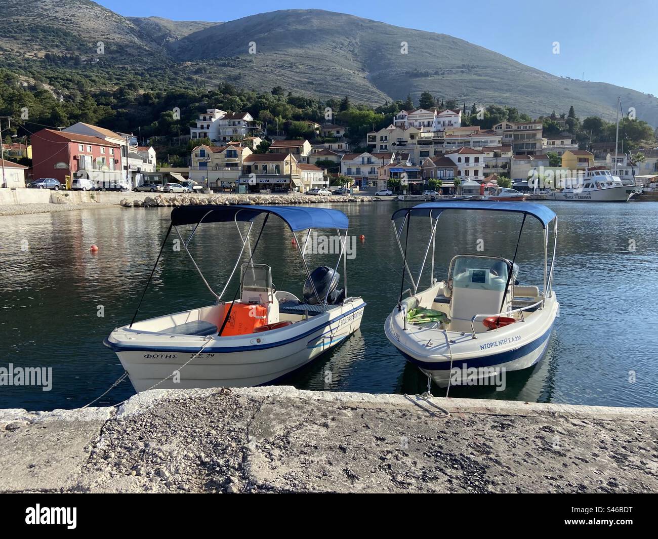 Two boats in the harbour at Agia Efimia, Kefalonia, Greece - Smartphone Captured Stock Image