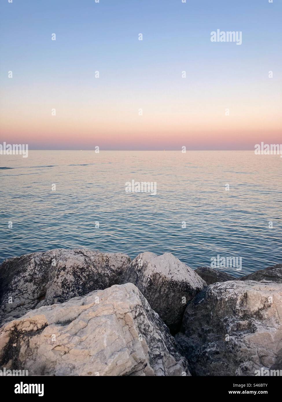 Rocks sea and sunset sky - Smartphone Captured Stock Image