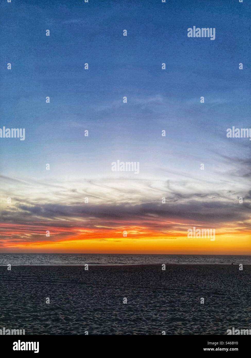 Sunset and clouds at Lagoa de Albufeira beach  . Setubal county,Sesimbra region,south of Portugal. - Smartphone Captured Stock Image