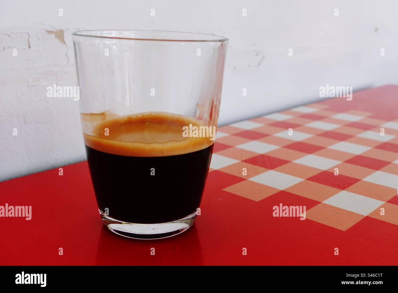 Coffee glass on red table Stock Photo Alamy