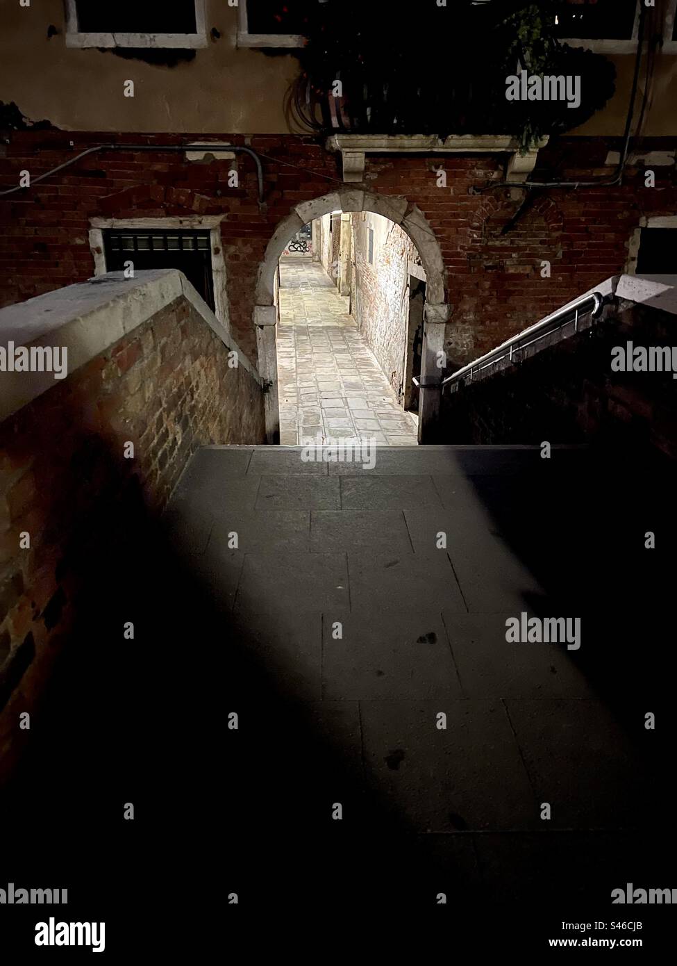 Sotoportego dei Preti at night, Rio di San Felice canal, Cannaregio Ghetto, Venice - Smartphone Captured Stock Image