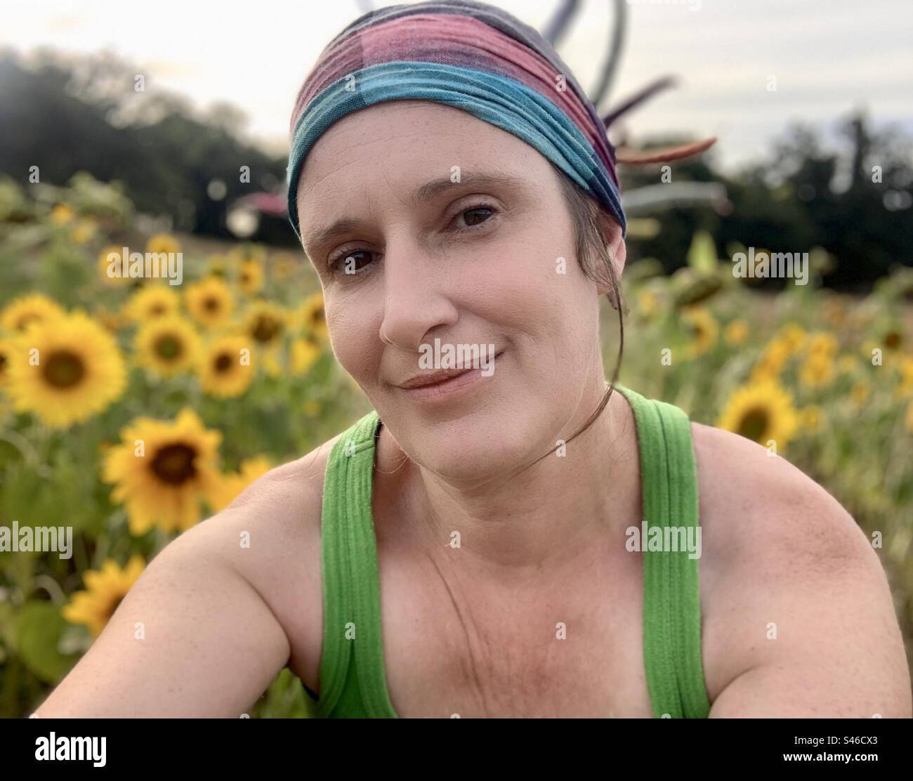 Woman in a field of sunflowers - Smartphone Captured Stock Image