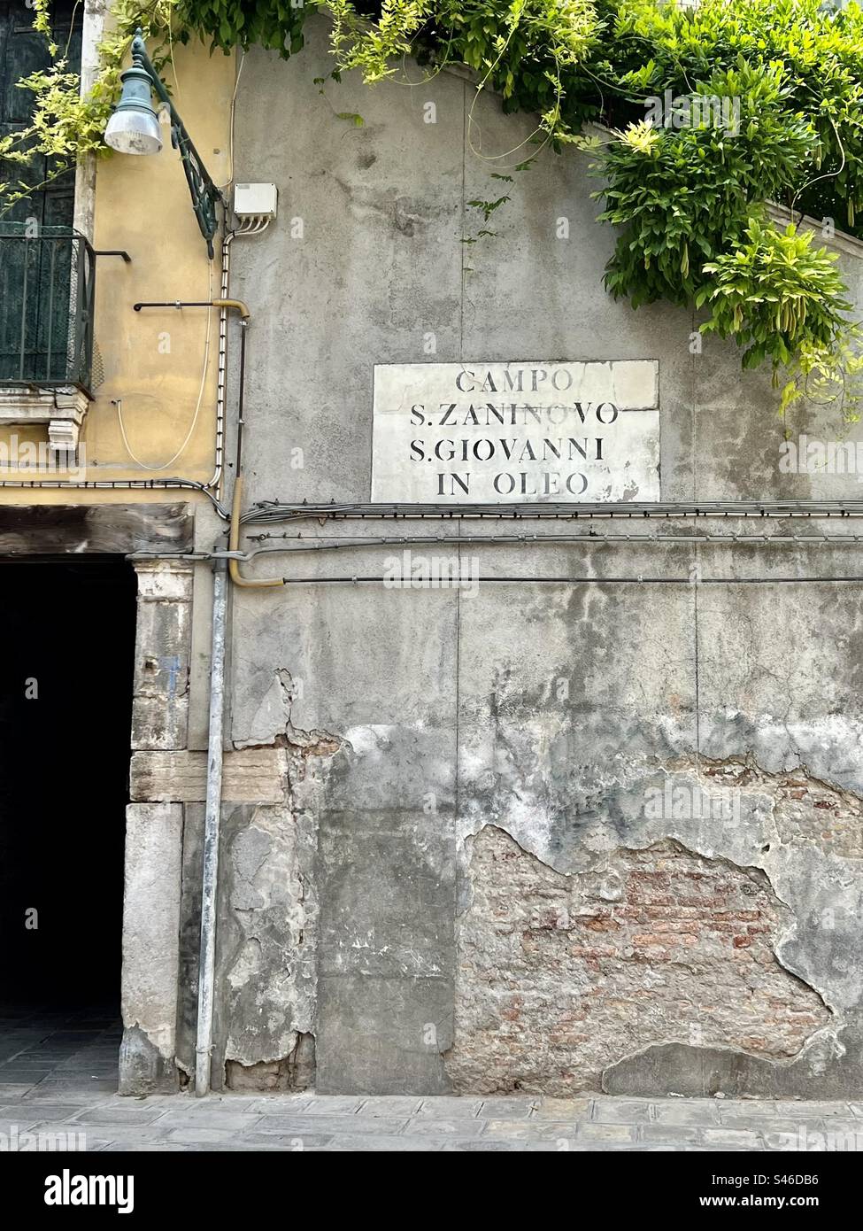 Signage on building in Campo San Zaninova marking the area of the deconsecrated church of the same name, also known as San Giovanni in Oleo or San Giovanni Novo, Venice. - Smartphone Captured Stock Image