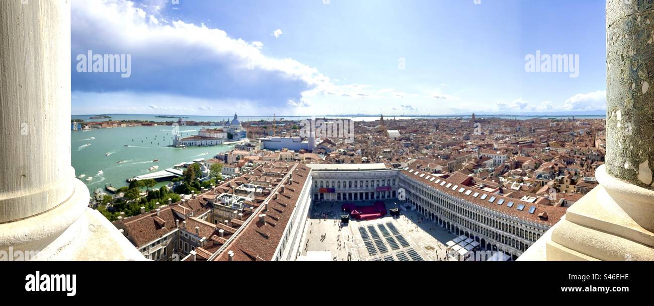 Panoramic view from between columned windows atop the St.Mark’s Bell Tower in Venice - Smartphone Captured Stock Image