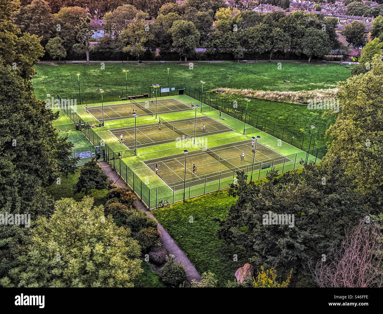 Aerial view of the Floodlit Tennis Courts in Ladywell Fields Park, Lewisham - Smartphone Captured Stock Image