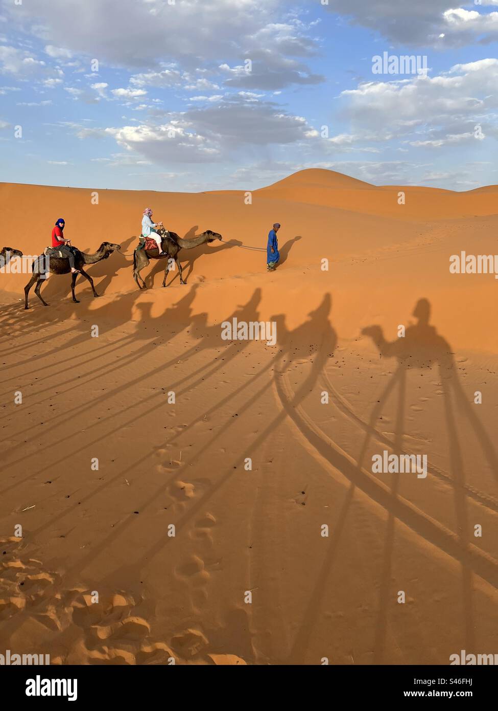 Sahara desert, camel ride on dunes, Morocco Stock Photo