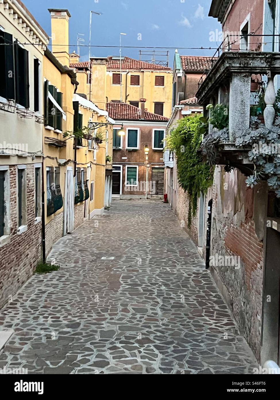 Calle de Vedei, a stone street with beautiful architecture, in the Cannaregio district of Venice on a summer night - Smartphone Captured Stock Image