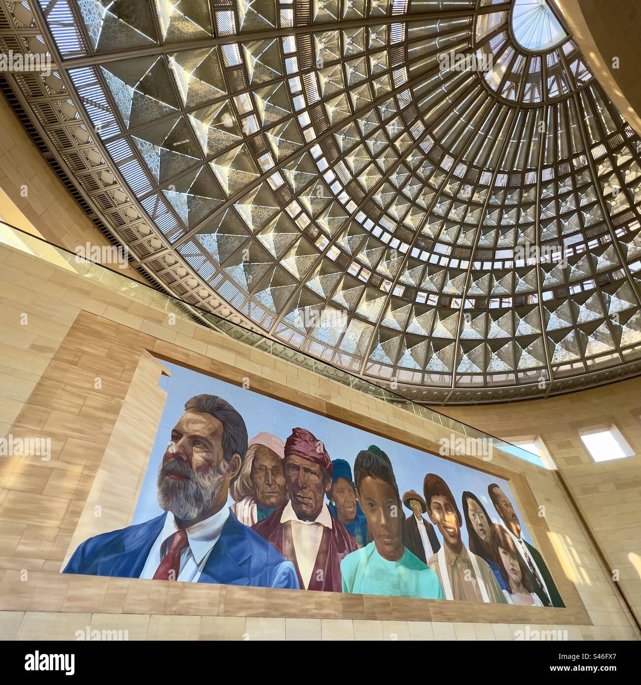 LOS ANGELES, CA, DEC 2022: mural and ornate glass ceiling inside entrance to Union Station in Downtown, next to Patsaouras Transit Plaza - Smartphone Captured Stock Image