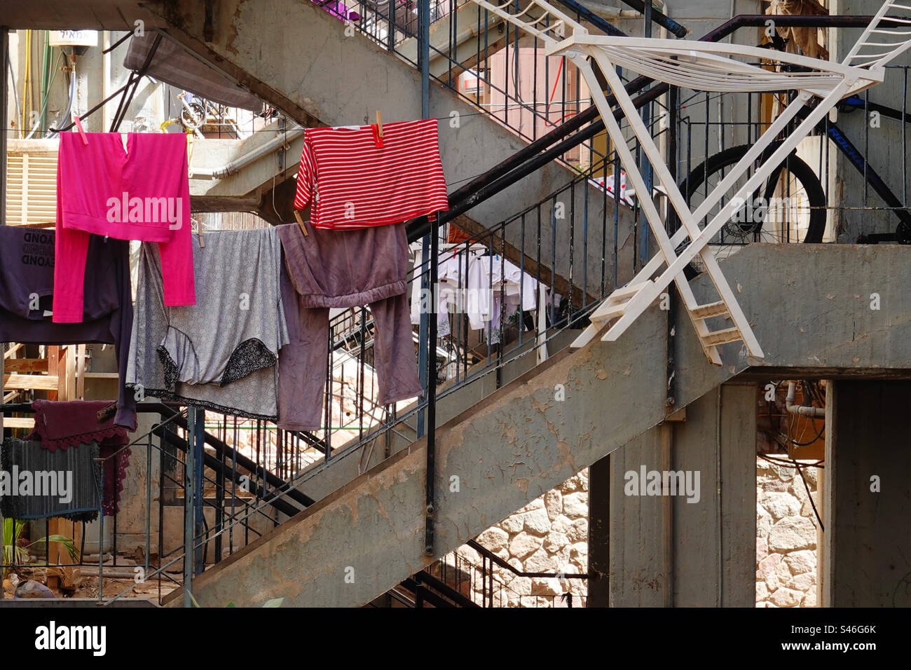 Clothesline between buildings Stock Photo Alamy