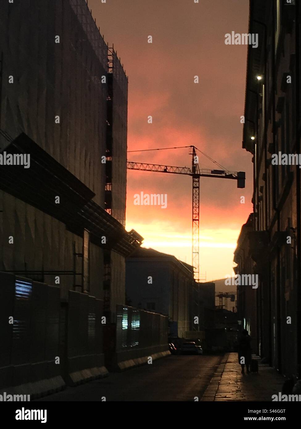 Crane at sunset. Phases of reconstruction after the earthquake in L'Aquila - Smartphone Captured Stock Image