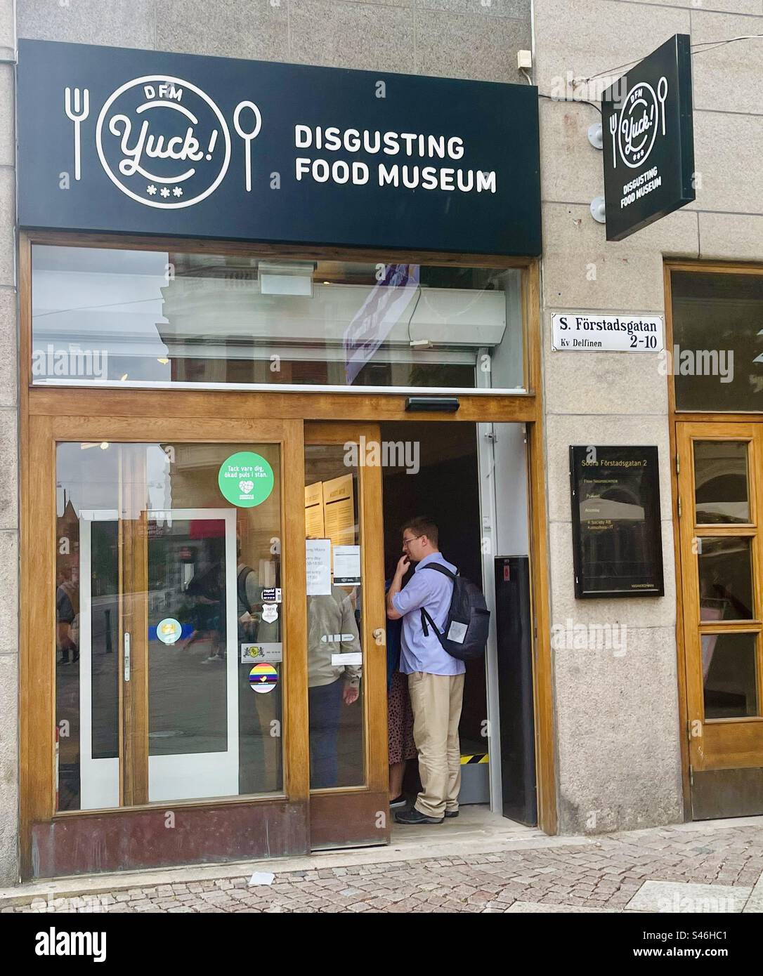 Visitors sampling foods at the tasting bar