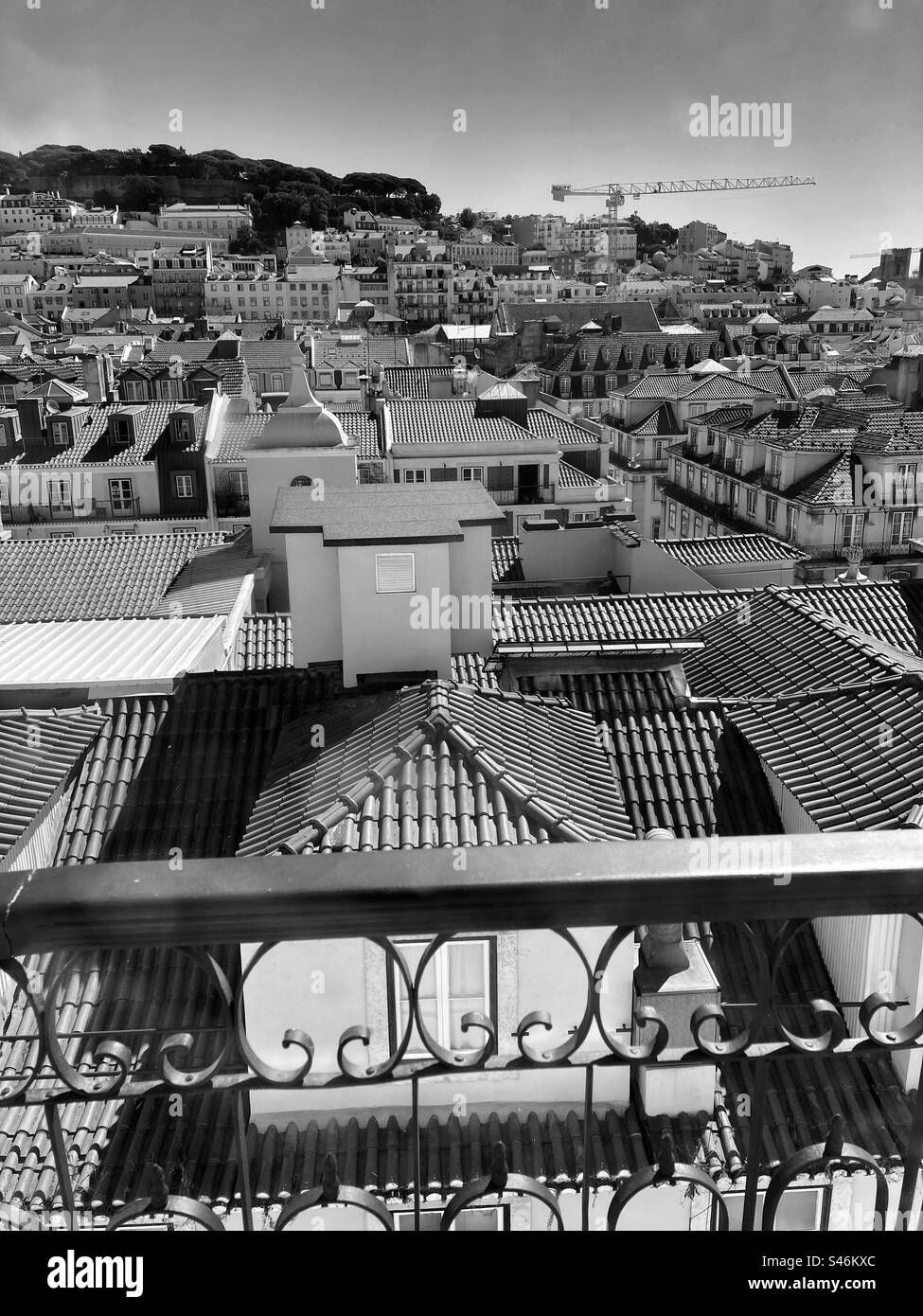 Wide view of Lisbon roofs till the hill of São Jorge Castle. Point of view from Chiado,downtown. Stock Photo