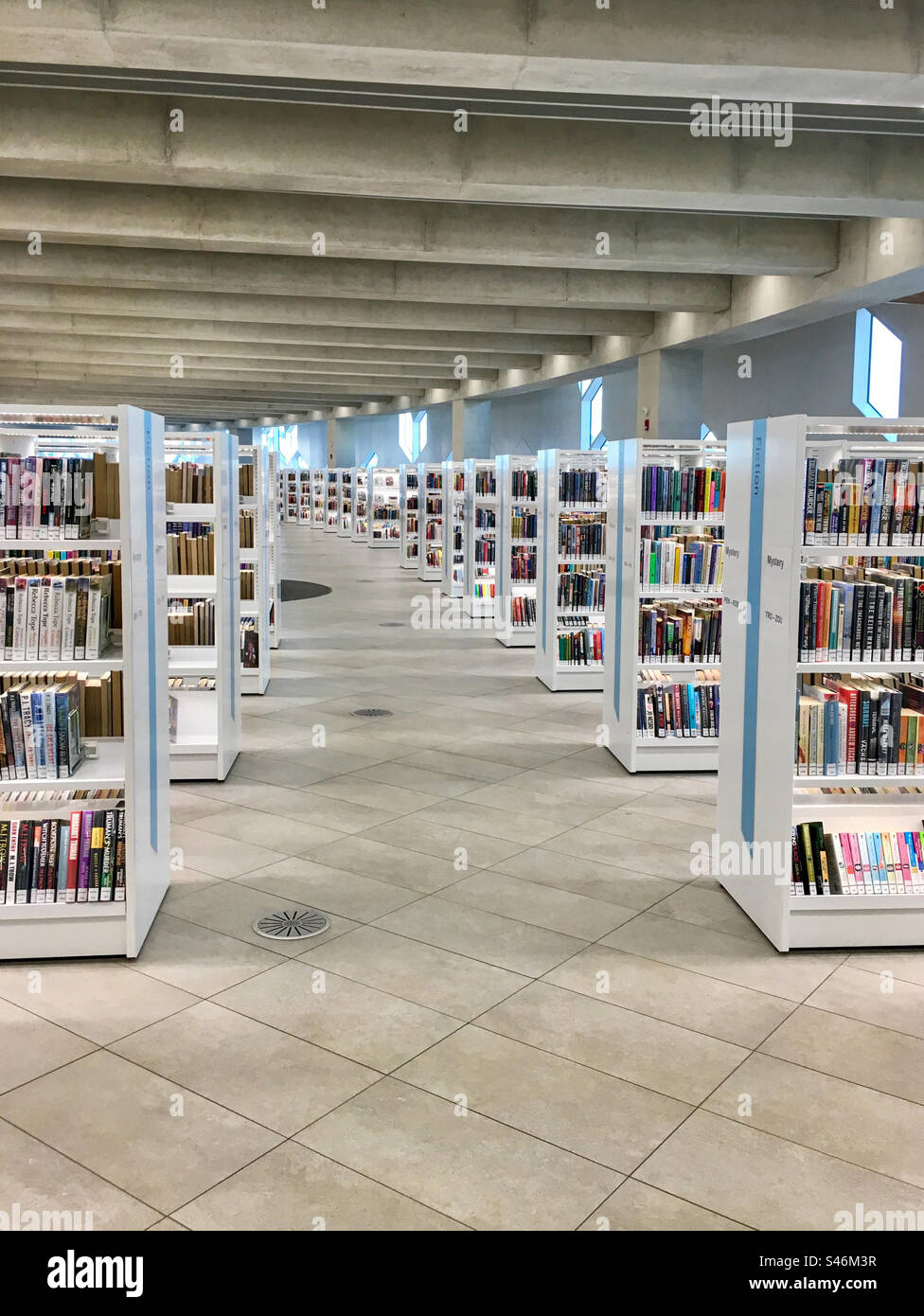 Aisle between bookshelves in a public library - Smartphone Captured Stock Image