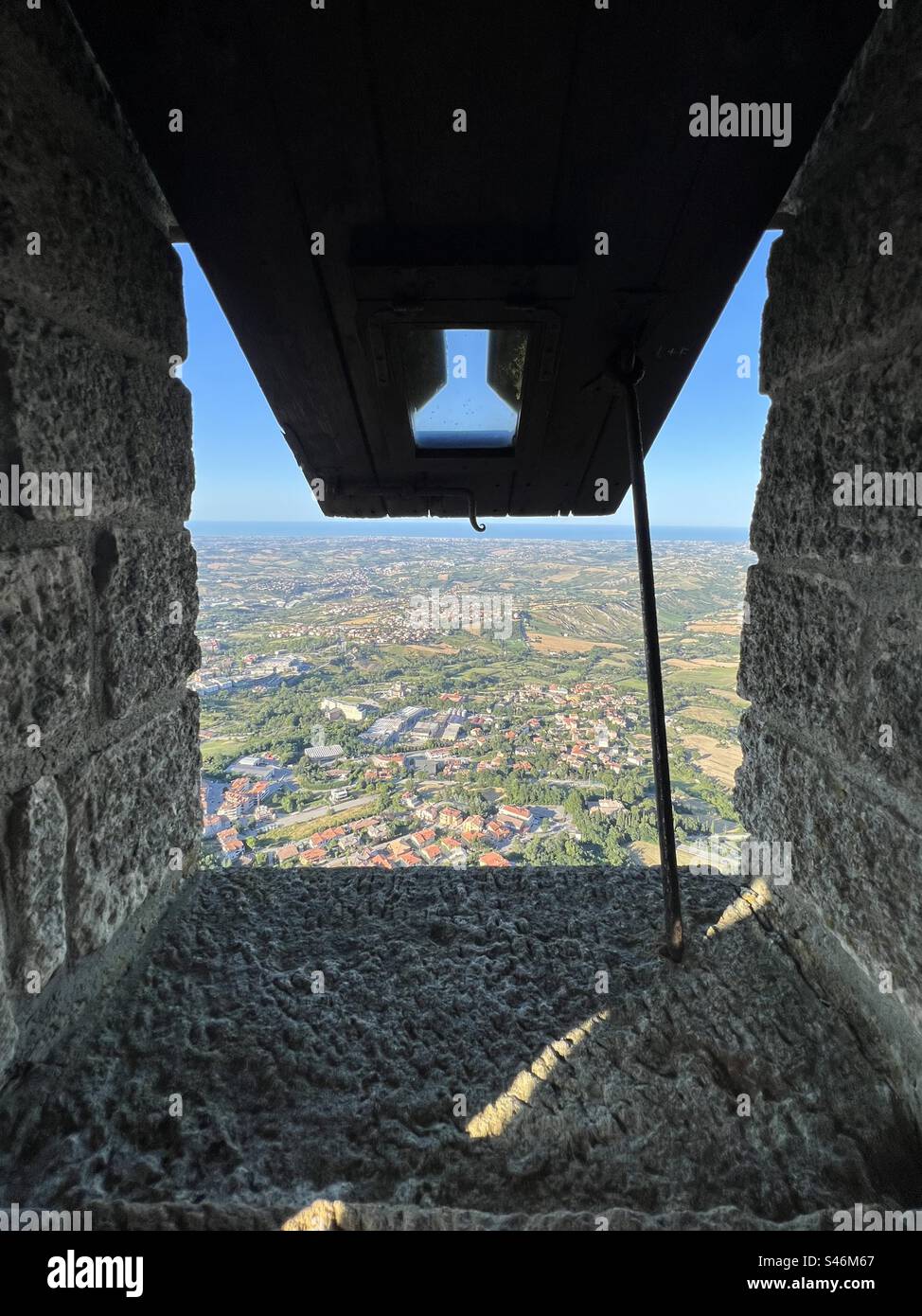 View of the valley in San Marino from a portal window in a tower of the Guaita fortress - Smartphone Captured Stock Image