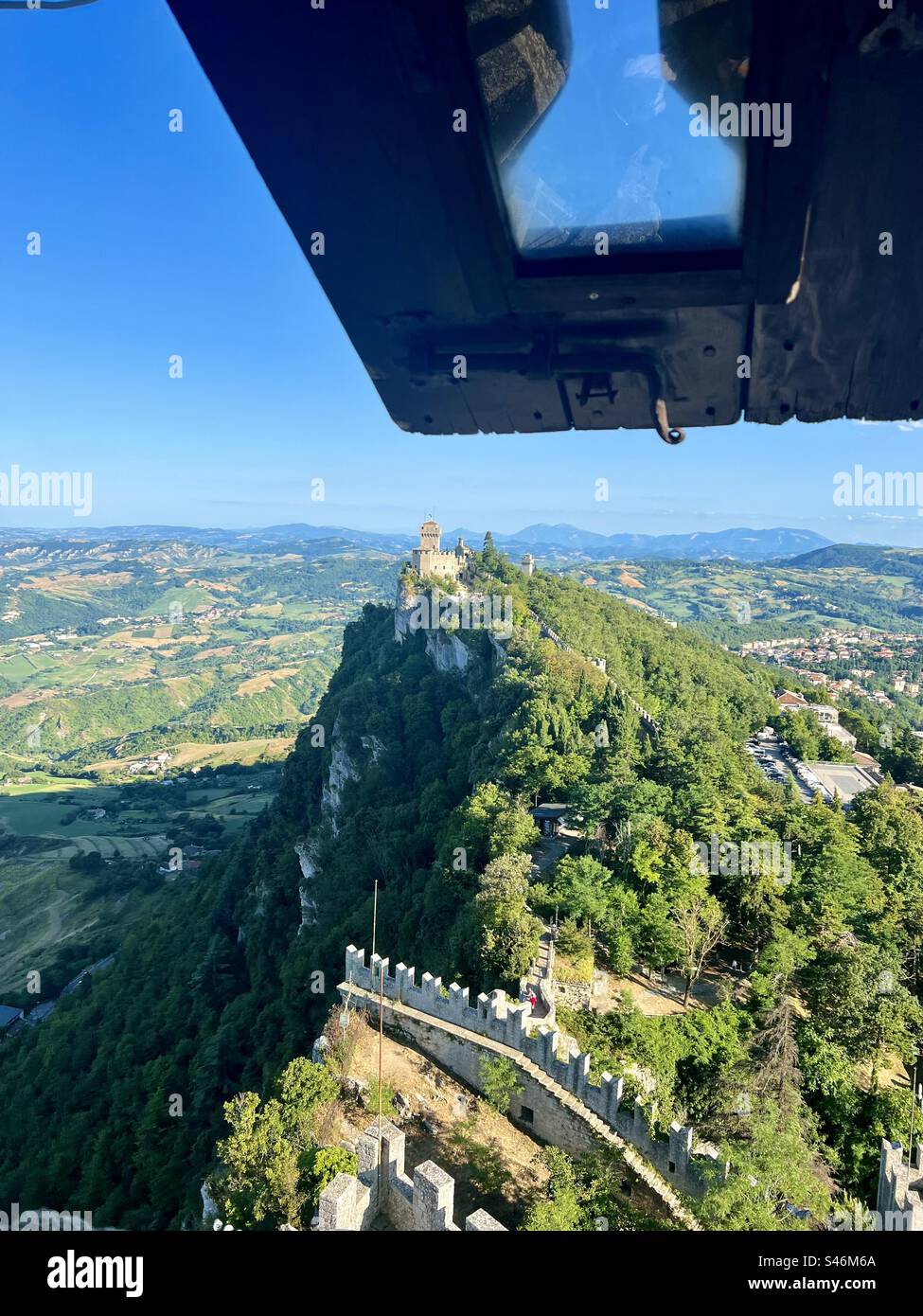Viewing the Second Tower of San Marino and the surrounding valley from a portal window in Guaita Fortress- First Tower - Smartphone Captured Stock Image