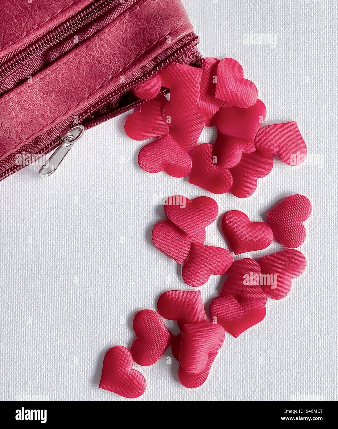 Red purse pours out hearts - Smartphone Captured Stock Image