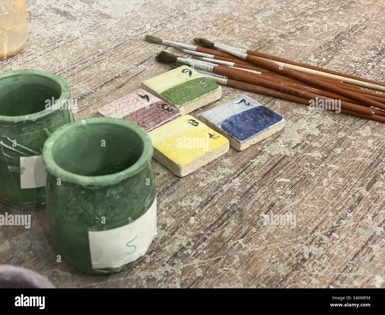 Tile painting materials in a tile factory located in Azeitão. Portugal 2023. - Smartphone Captured Stock Image