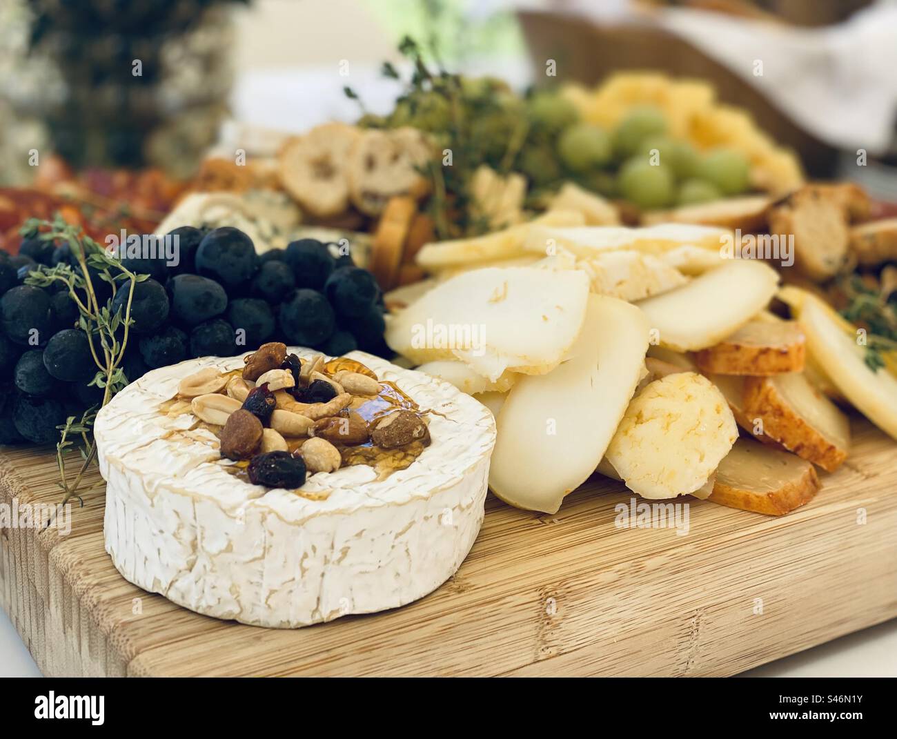 Cheese platter at lunch party. Cascais, Portugal, 2023. - Smartphone Captured Stock Image