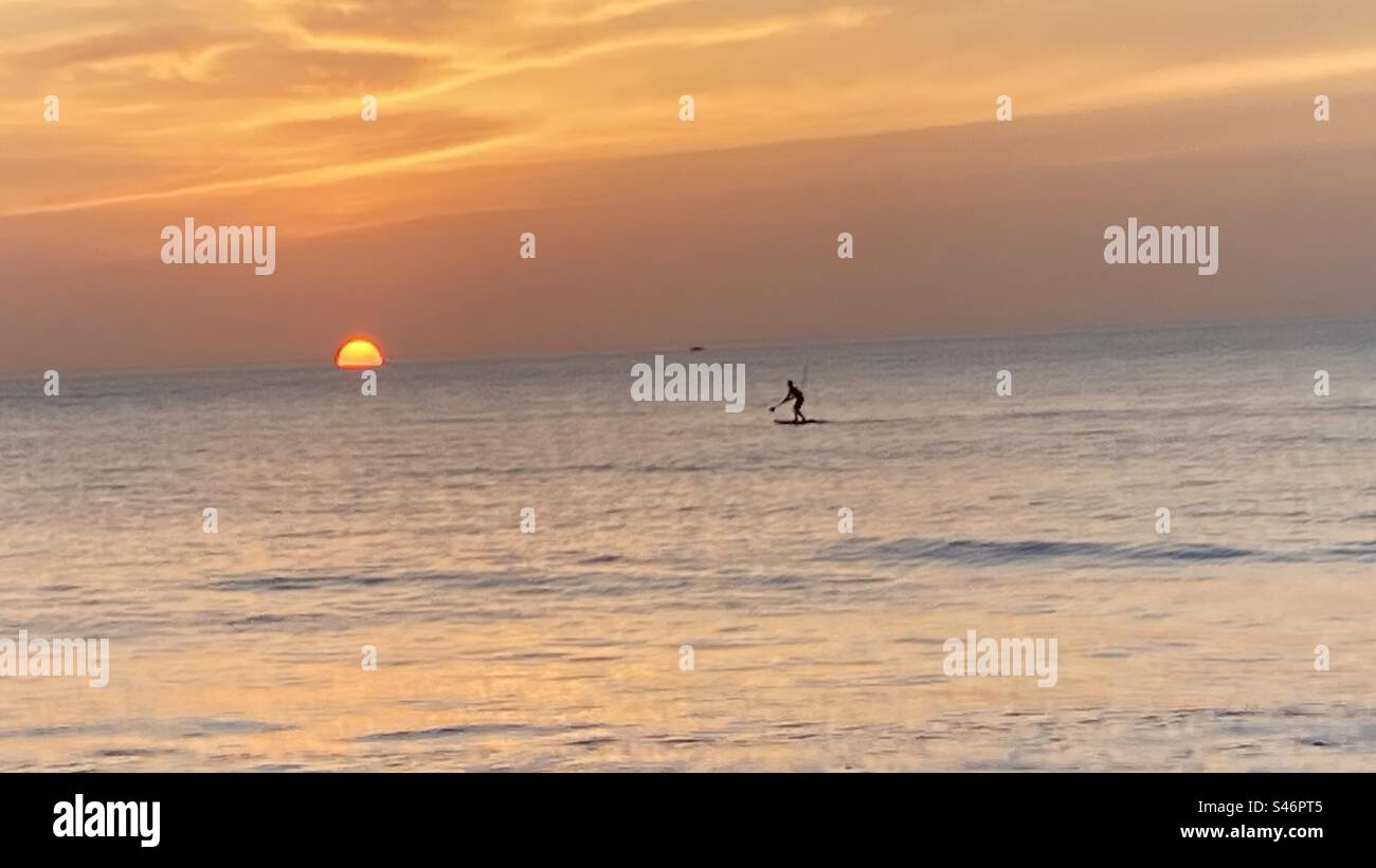 Paddle boarding at sunrise in Floridas Atlantic Ocean - Smartphone Captured Stock Image