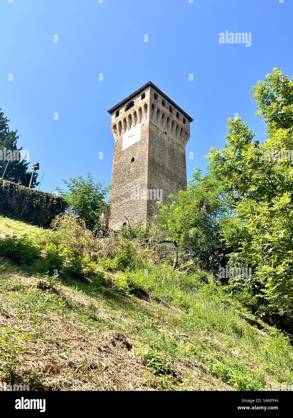 The square Torre on the grounds of Levizzano Castle in the hills of Emilia-Romagna - Smartphone Captured Stock Image