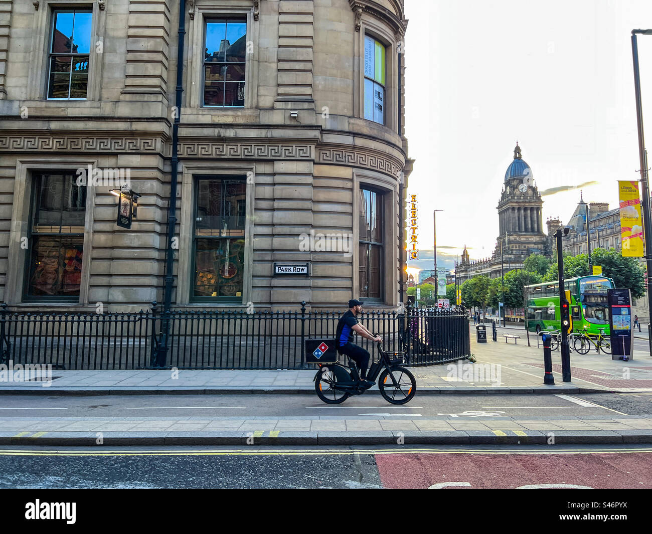 Dominoes pizza delivery cyclist in Leeds City Centre - Smartphone Captured Stock Image